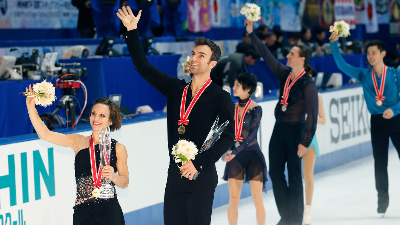 Meagan Duhamel and Eric Radford take their victory lap following the gold medal presentation. 