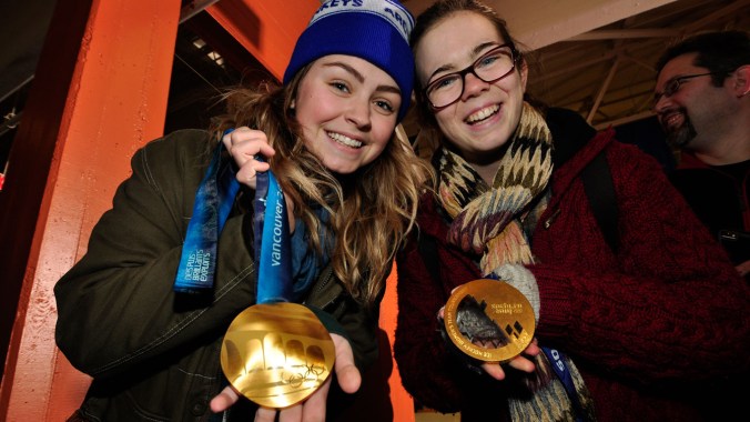 Trail, BC - Teck, fans with Olympic gold medals Fans had a chance to feel Olympic hardware prior to the Smoke Eaters game.