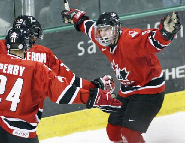 SIDNEY CROSBY COREY PERRY PATRICE BERGERON SidneyCrosby, right, celebrates a goal with Patrice Bergeron and Corey Perry during the 2005 World Juniors (Photo: CP)