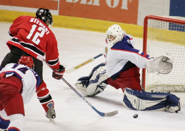 STEWART/KHUDOBIN/MEGALINSKI Anthony Stewart scores on the Russians in the final (Photo: CP)