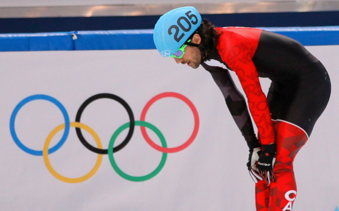 Charles Hamelin of Canada crashed out in a men's 500m short track speedskating heat at the Iceberg Skating Palace during the 2014 Winter Olympics, Tuesday, Feb. 18, 2014, in Sochi, Russia. (AP Photo/Vadim Ghirda)