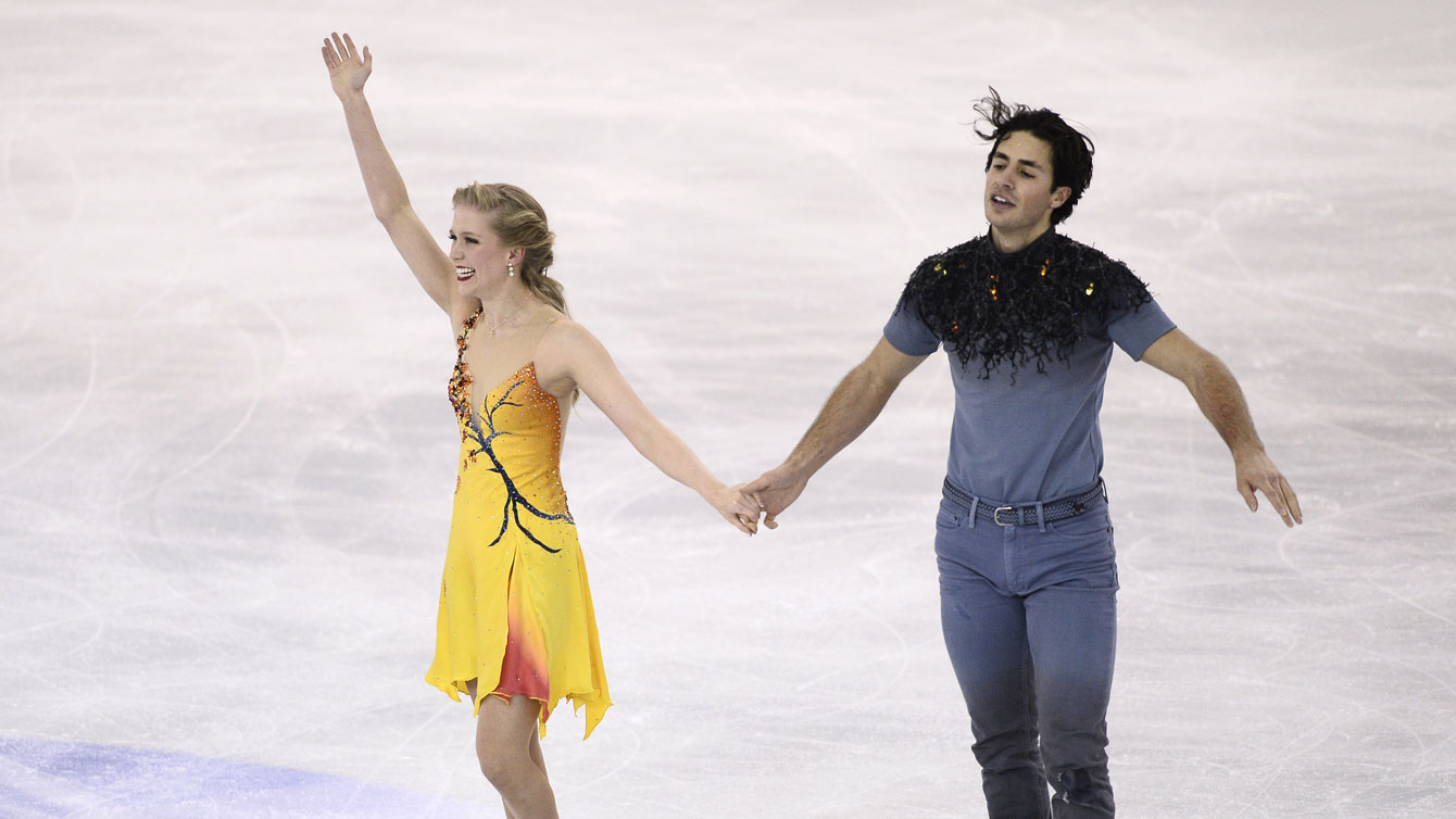 Kaitlyn Weaver and Andrew Poje at the conclusion of the free dance before being crowned ice dance champions at the Grand Prix Final in Barcelona, Spain.