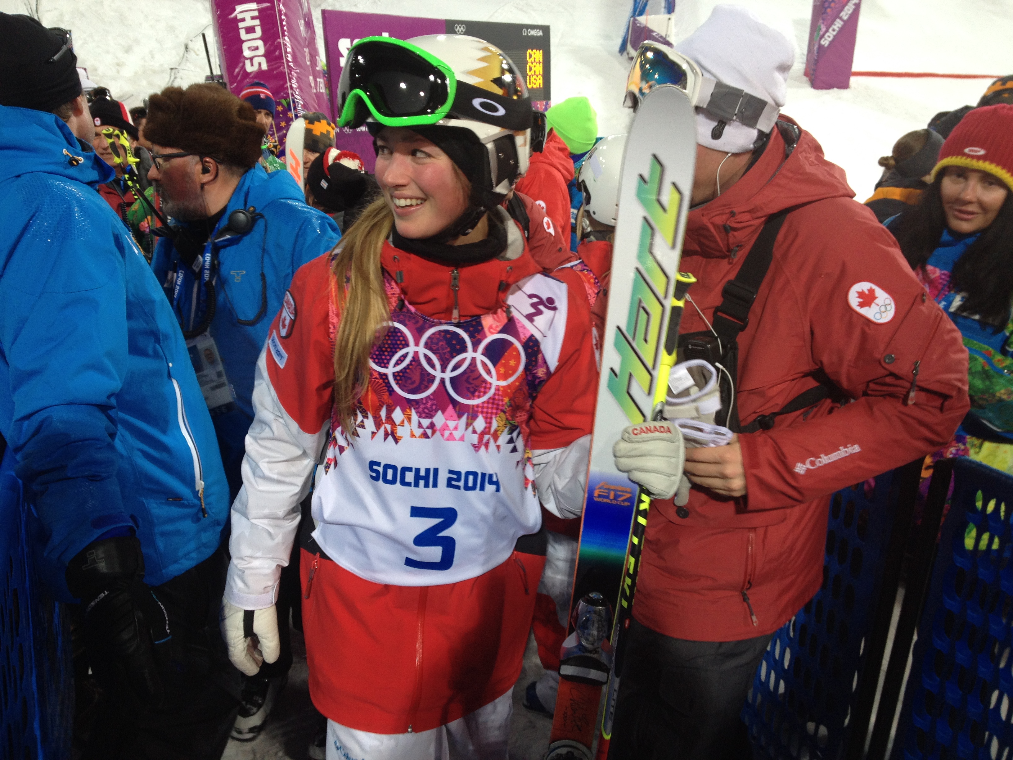 Silver medalist Chloé Dufour-Lapointe makes her way through the crowd moments after stepping down from the women's moguls podium in Sochi. Photo: Steve Boudreau