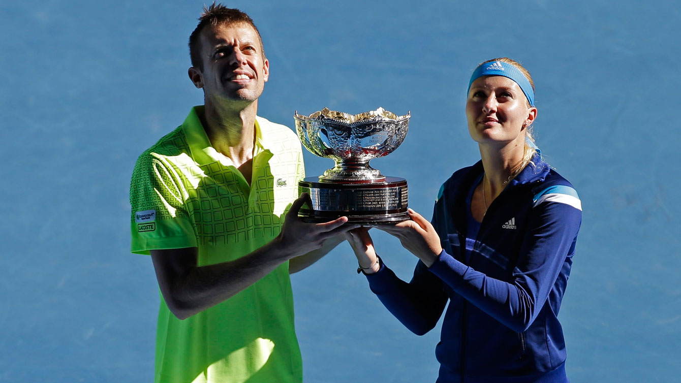 Nestor & Mladenovic hold up the Australian Open mixed doubles trophy in 2014.