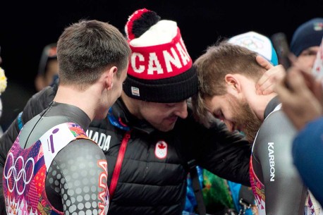 Sam Edney comforts doubles luge teammates Justin Snith (L) and Tristan Walker (R) (Sochi)
