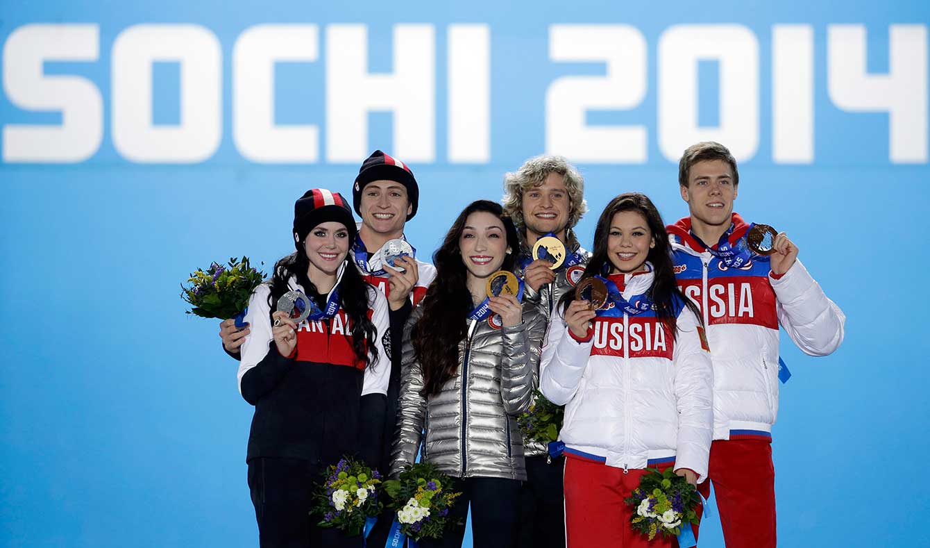 Tessa Virtue and Scott Moir at the victory ceremony for ice dance in Sochi.