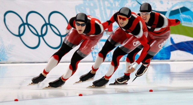 Canadian speedskaters Denny Morrison , left to right, Lucas Makowsky and Mathieu Giroux race to a gold medal finish during the men's team pursuit finals at the Olympic Winter Games in Richmond, B.C., Saturday, Feb. 27, 2010 at the 2010 Vancouver Olympic Winter Games. THE CANADIAN PRESS/Robert Skinner