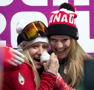 Kaillie Humphries and Heather Moyse await the results of bobsleigh competition in Sochi.
