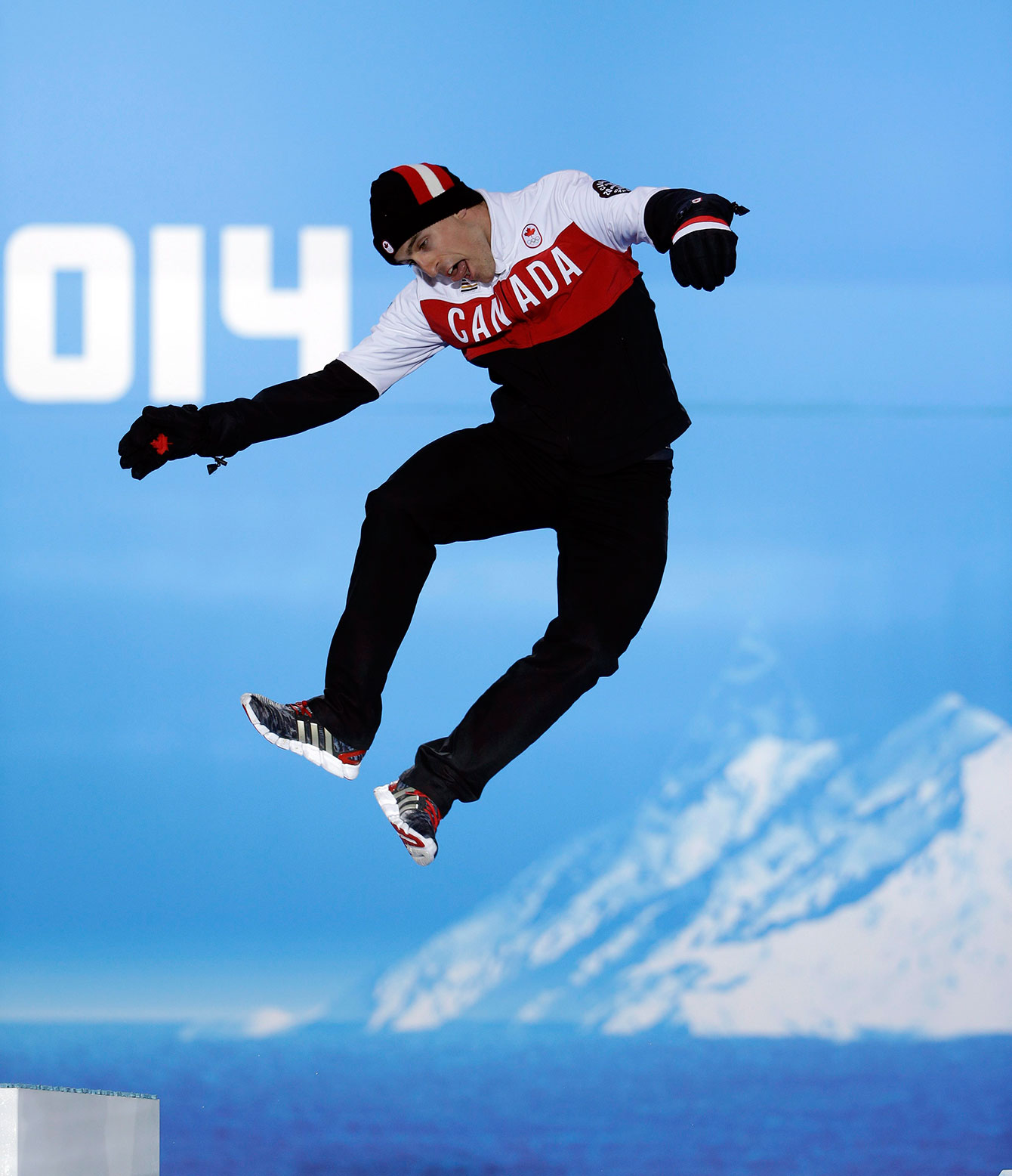Denny Morrison hops onto the podium in Sochi.