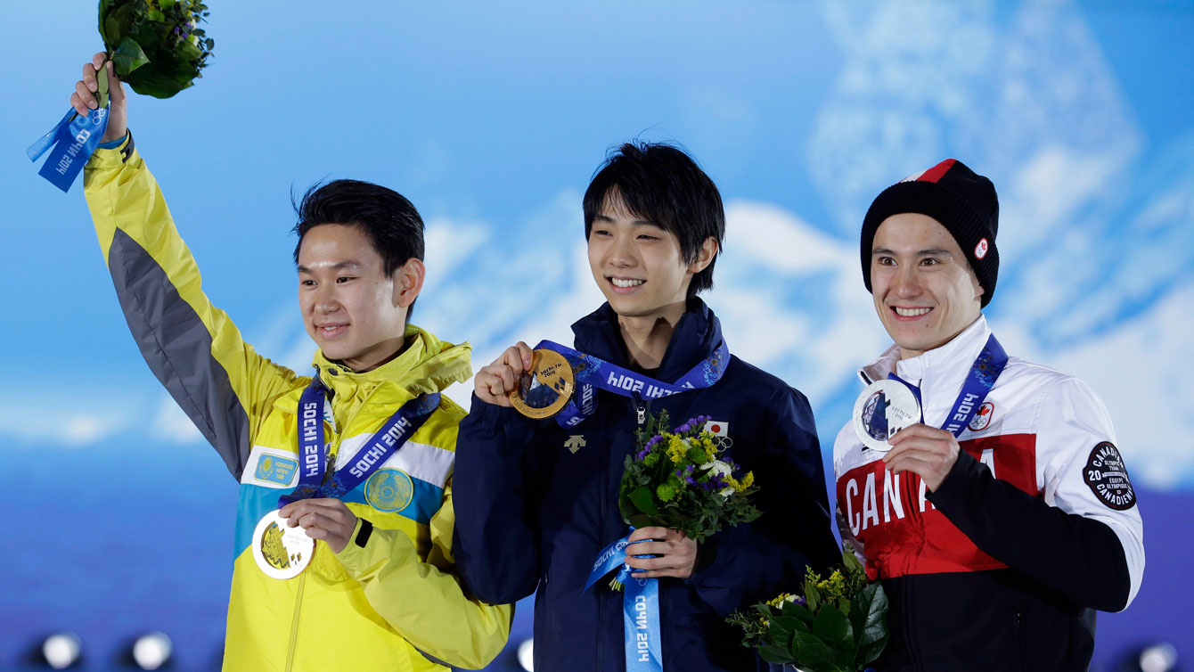 Denis Ten (left) shares a Sochi medal podium with Canada's Patrick Chan (right). 