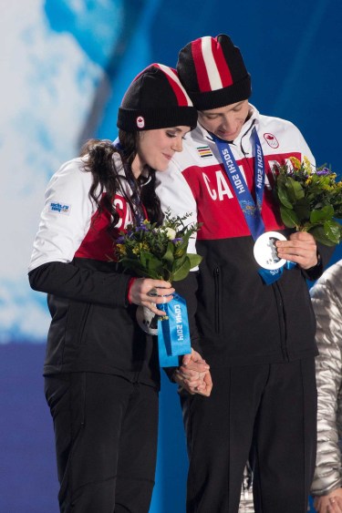 Tessa Virtue and Scott Moir at the victory ceremony for ice dance in Sochi.