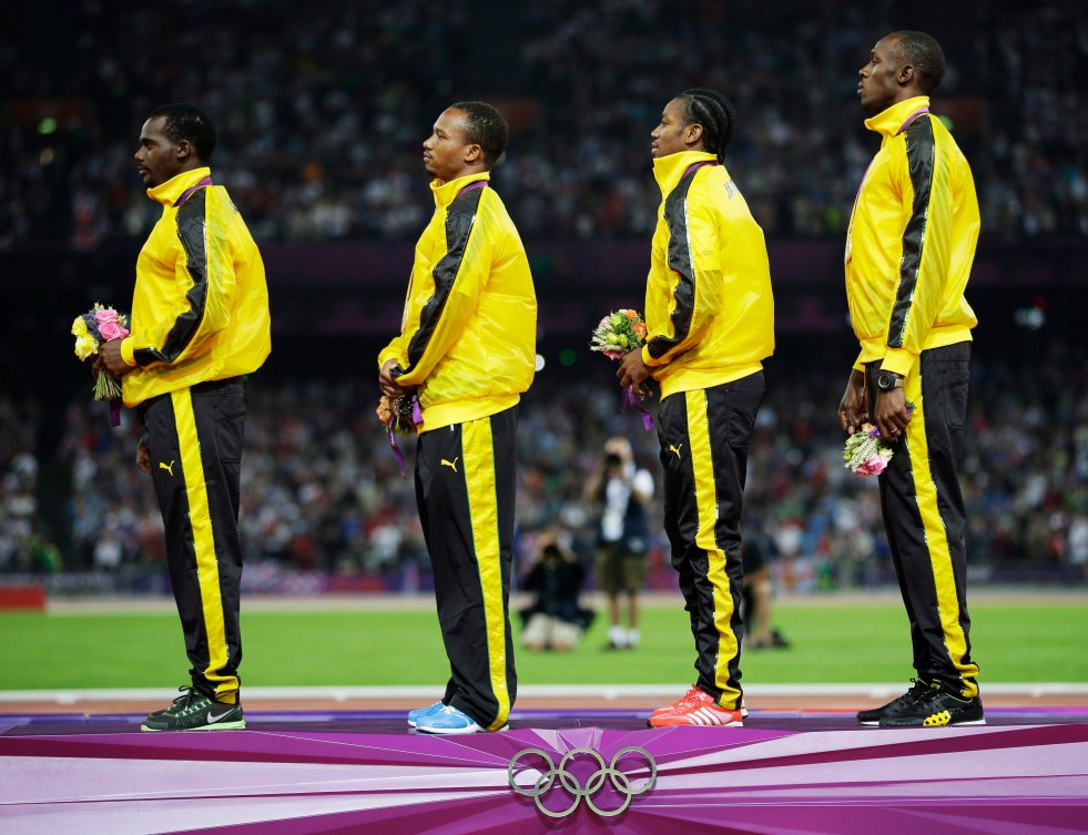 Usain Bolt (right), Yohan Blake (second right), and their Jamaican teammates at London 2012. 
