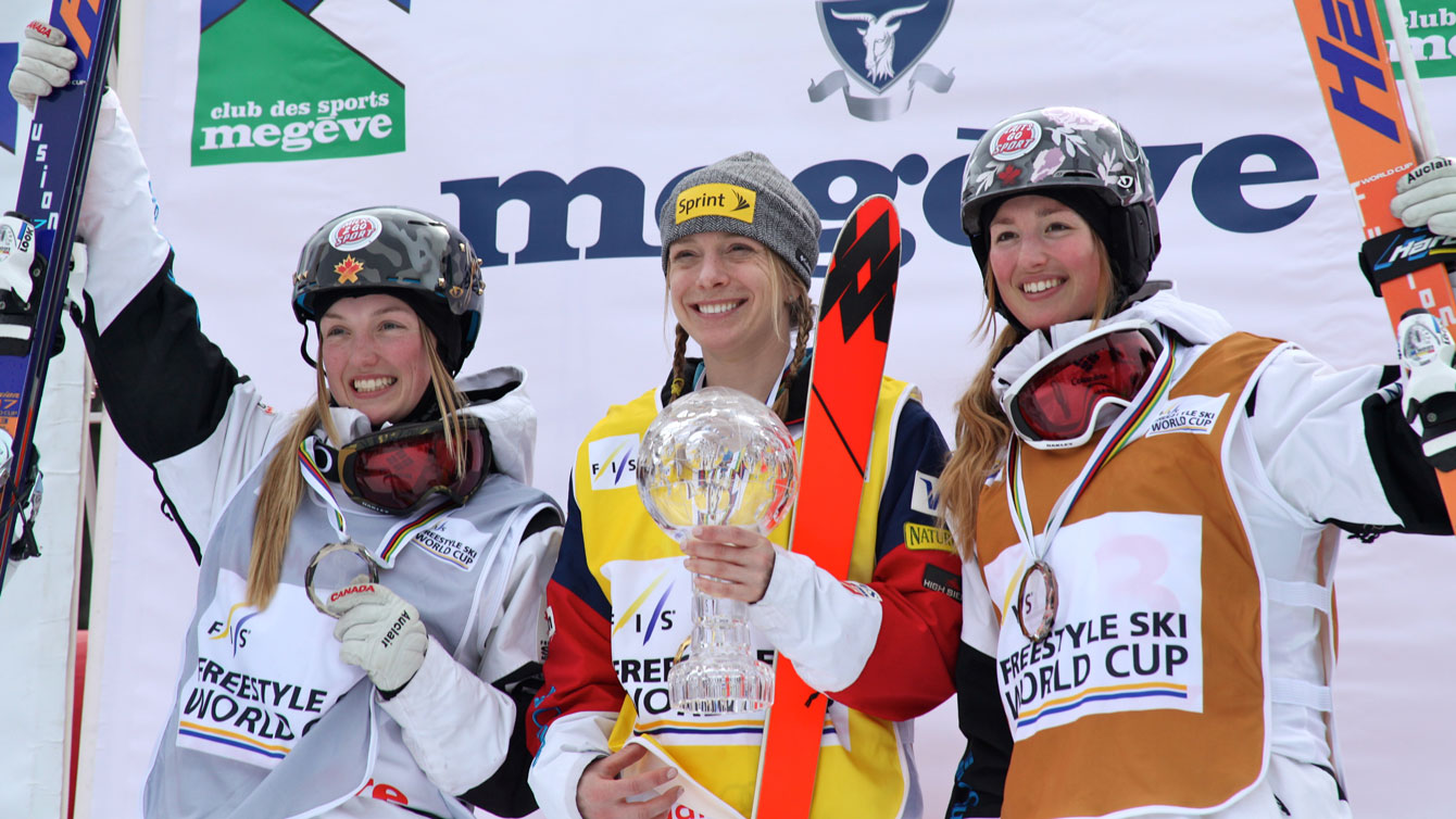 Justine Dufour-Lapointe (left) finishes second and older sister Chloé third in the overall 2014-15 moguls standings behind American Hannah Kearney (Photo: Chad Bucholz/FIS). 
