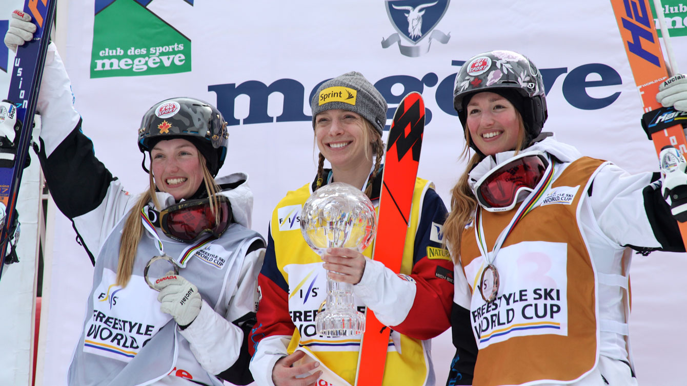 Justine Dufour-Lapointe (left) finishes second and older sister Chloé third in the overall 2014-15 moguls standings behind American Hannah Kearney (Photo: Chad Bucholz/FIS).