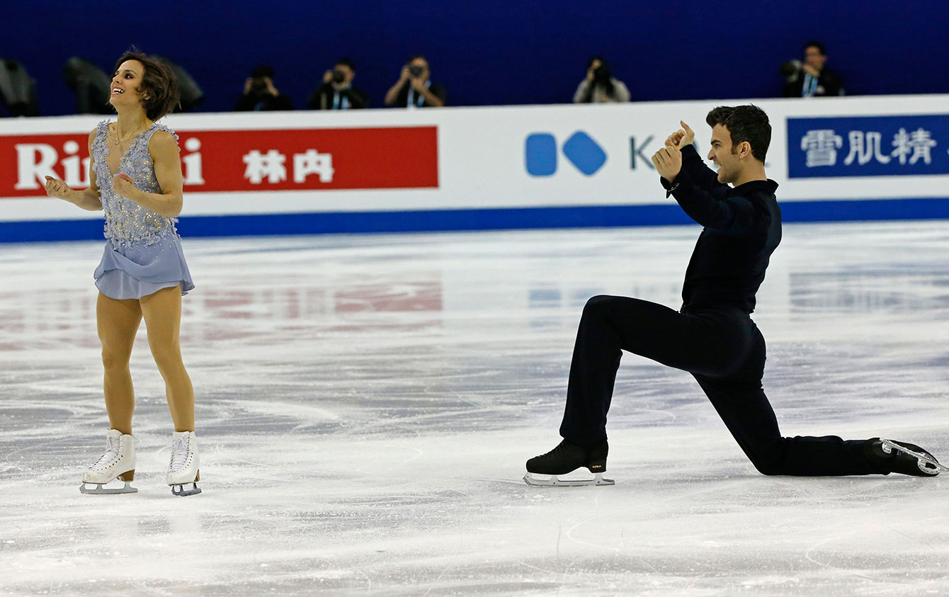 Meagan Duhamel and Eric Radford after their pairs short program at the ISU World Figure Skating Championship 2015 held at the Oriental Sports Centre in Shanghai, China, Wednesday, March 25, 2015.