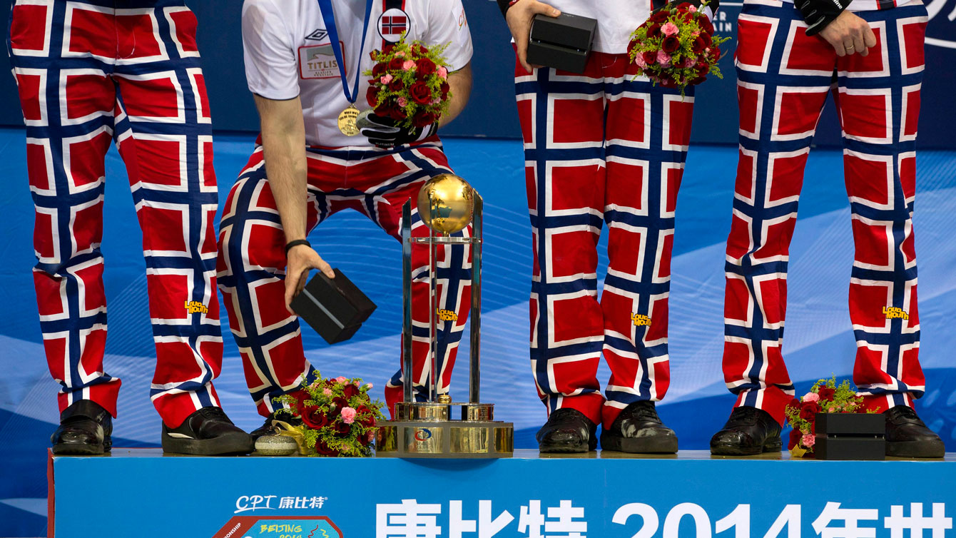 Team Norway with their trademark flag pants on the gold medal podium at the 2014 curling World Championship in Beijing. 