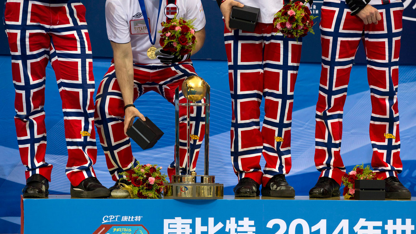 Team Norway with their trademark flag pants on the gold medal podium at the 2014 curling World Championship in Beijing.