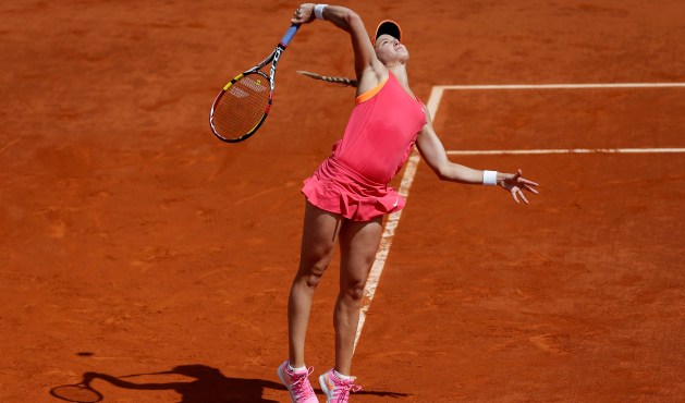 Eugenie Bouchard slams a serve to Russia's Maria Sharapova during the semifinal match of the French Open, June 5, 2014.