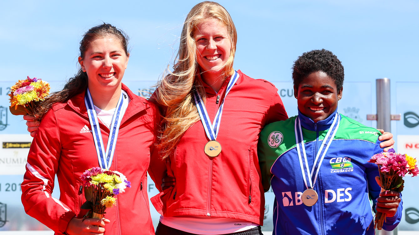 Canada's Laurence Vincent-Lapointe (centre) and Katie Vincent (left) on the C-1 200m World Cup podium with Brazil's Valdenice Nascimento on May 17, 2015 in Portugal.