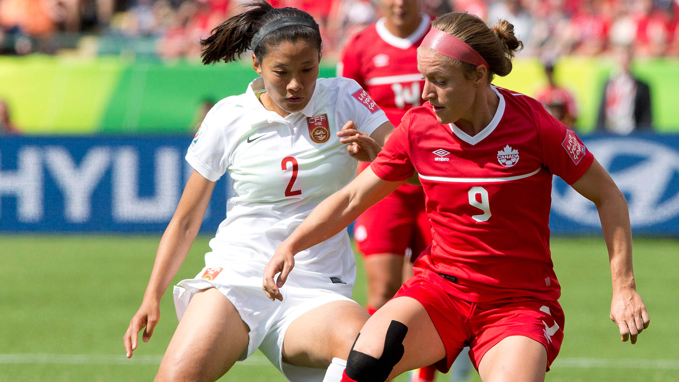 Josee Belanger of Canada protects the ball from Liu Shanshan of china at the FIFA Women's World Cup on June 6, 2015. 