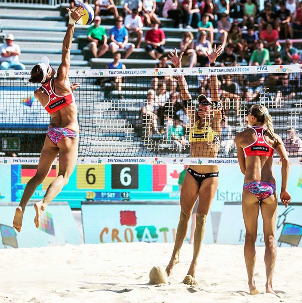 Jamie Broder hits a ball on Tour this season. Kristina Valjas watches. (Photo: Jamie Broder Instagram)