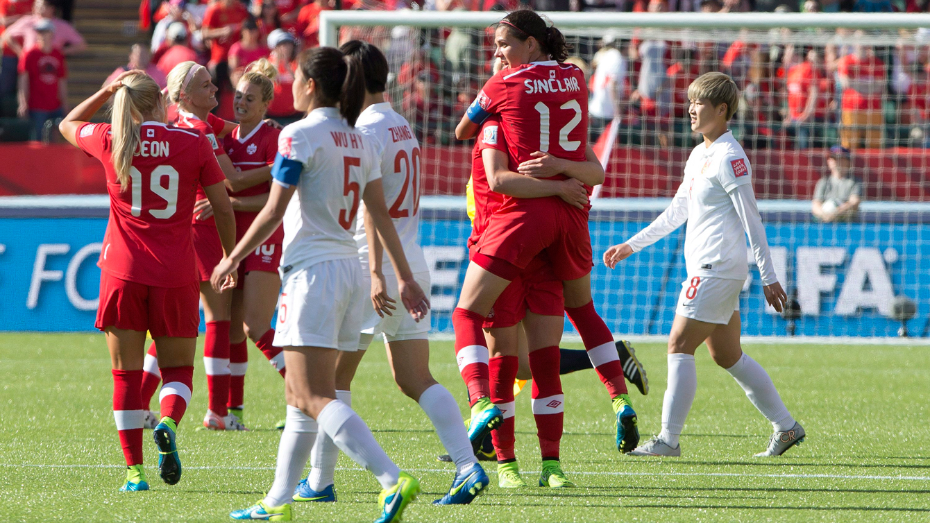 Canadian players celebrate beating China at the opener of the 2015 FIFA Women's World Cup on June 6, 2015. 