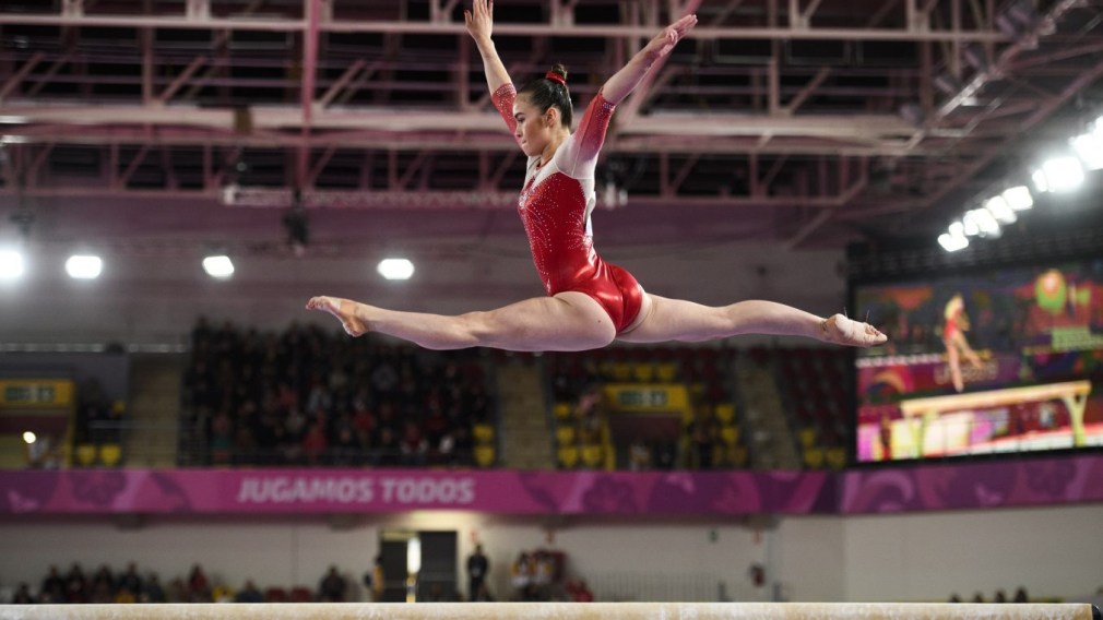 Victoria Woo of Canada competes in the balance beam portion