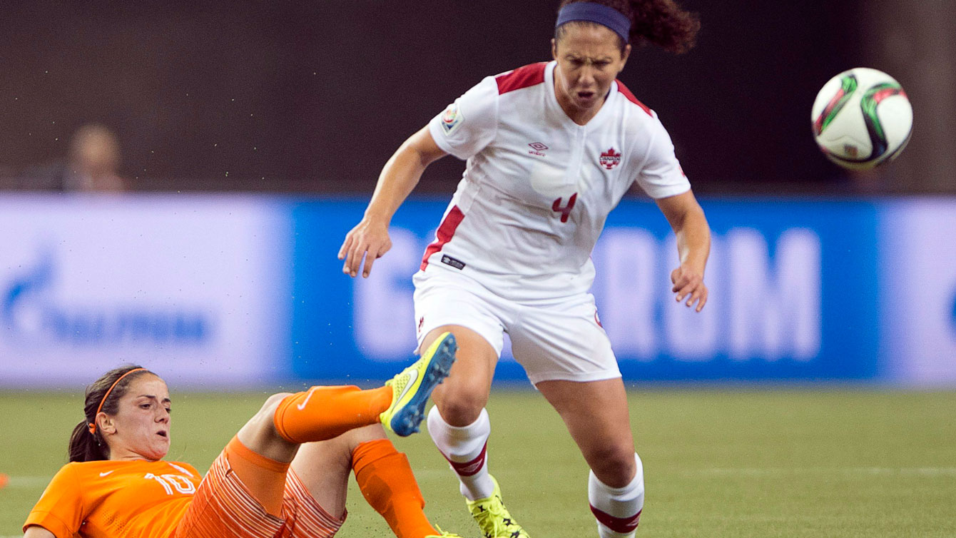 Carmelina Moscato of Canada (right) in a challenge for the ball with Danielle van de Donk of Netherlands at the FIFA Women's World Cup on June 15, 2015.
