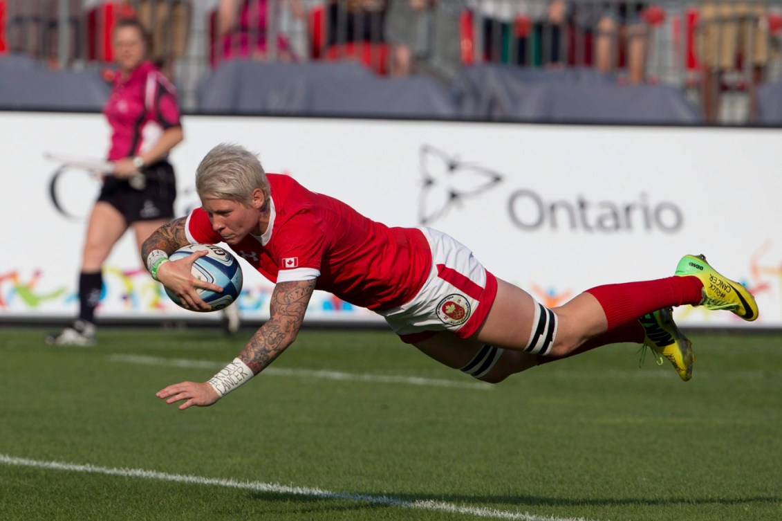 Women's team captain Jenn Kish dives for one of her many tries during the tournament. (Photo: Canadian Press)