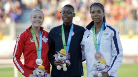 Shamier Little, Sarah Wells and Deborah Rodriguez pose on the podium