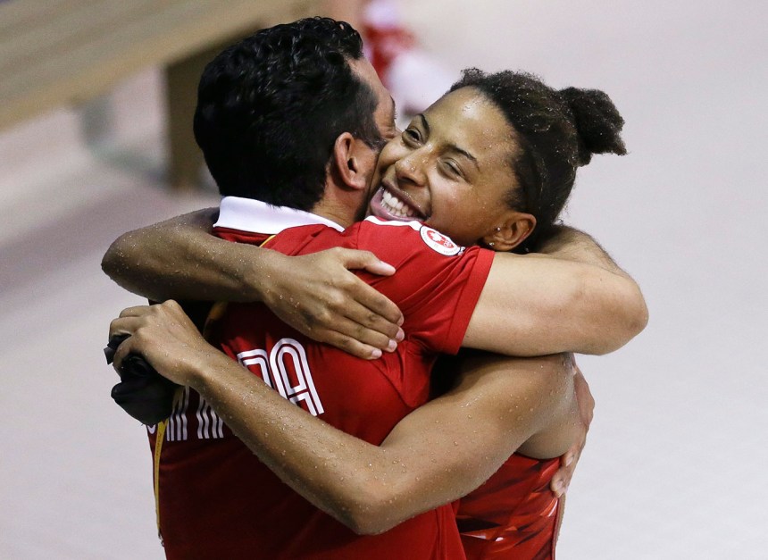 Jennifer Abel hugs coach Arturo Miranda after winning 3-metre gold at TO2015.
