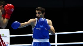 Team Canada's Arthur Biyarslanov throws a punch during his quarterfinals fight