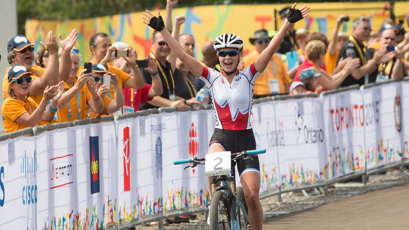 Emily Batty celebrates after winning Pan Am Games mountain bike race on July 12, 2015. 