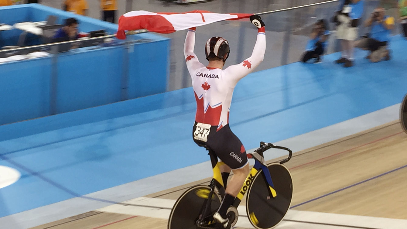 Canadian cyclist celebrates men's sprint track cycling Pan Am Games gold on July 16, 2015.