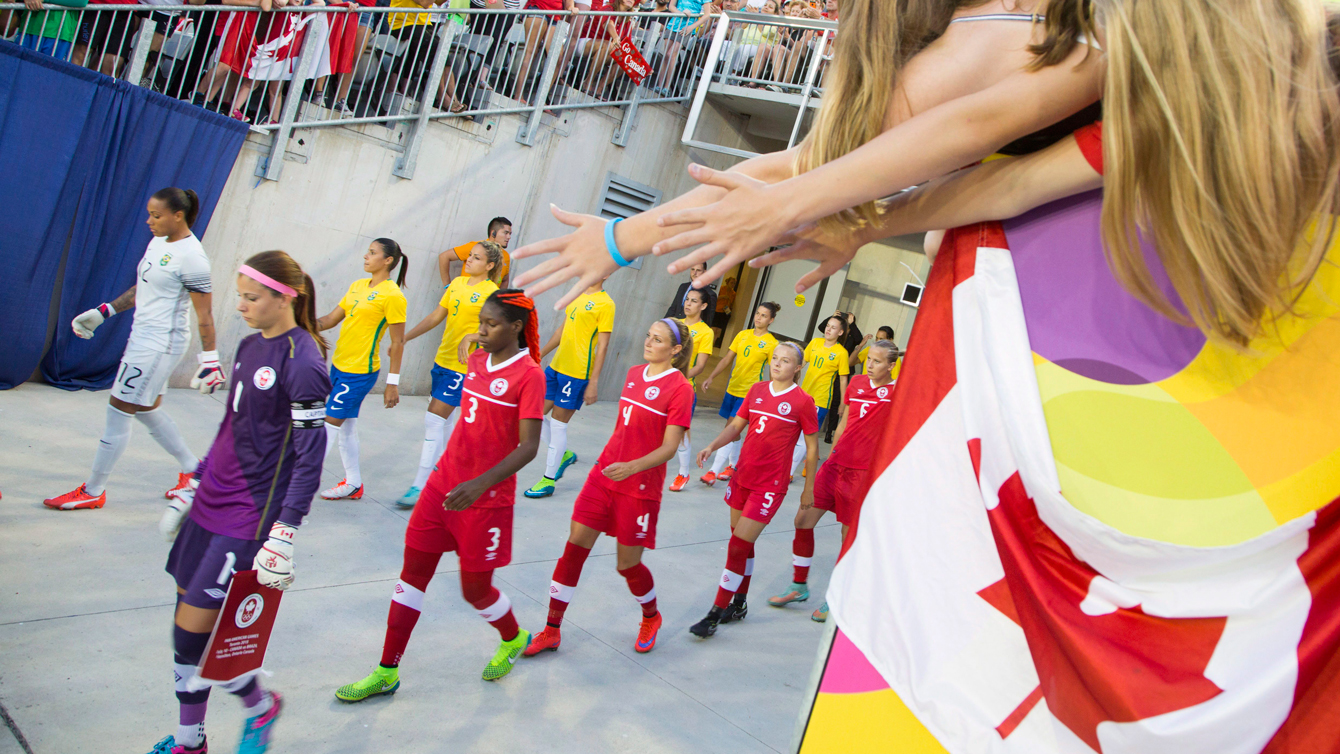 Canada walks out against Brazil in round robin women's football on July 19, 2015 at the Pan Am Games.