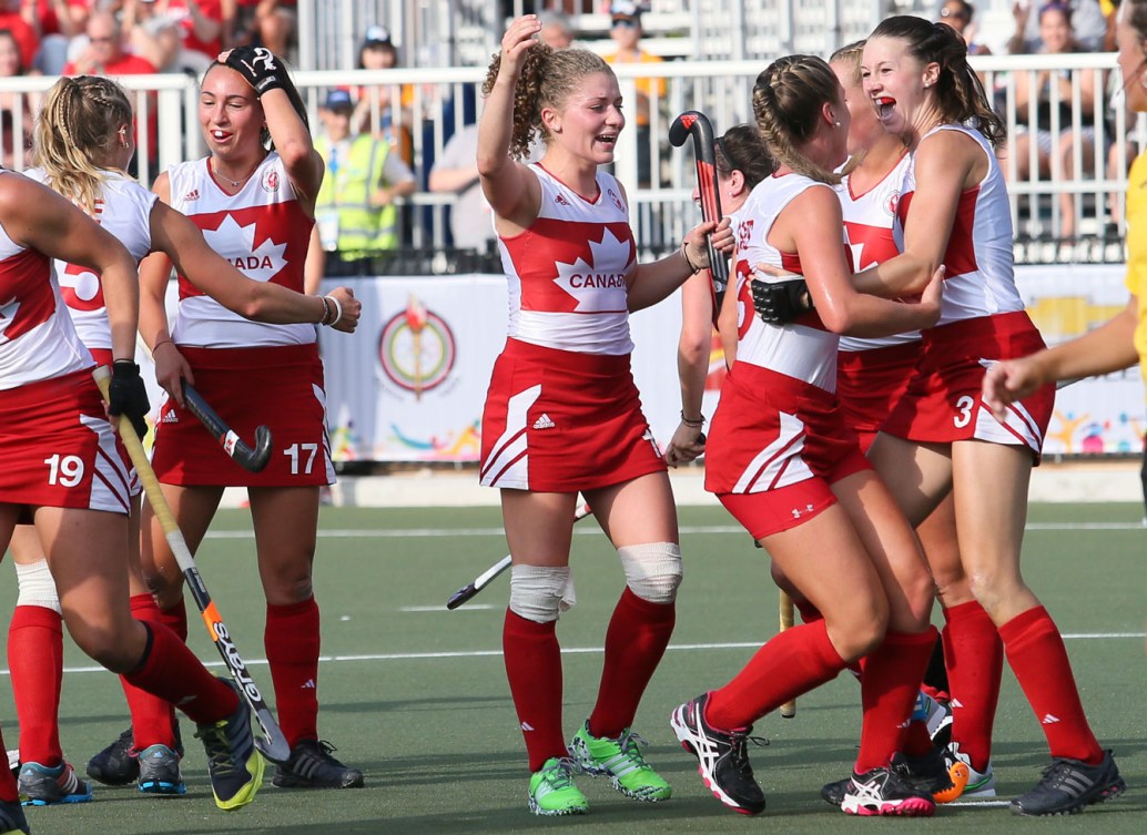 Canada celebrates their bronze medal in women's field hockey on July 24, 2015.