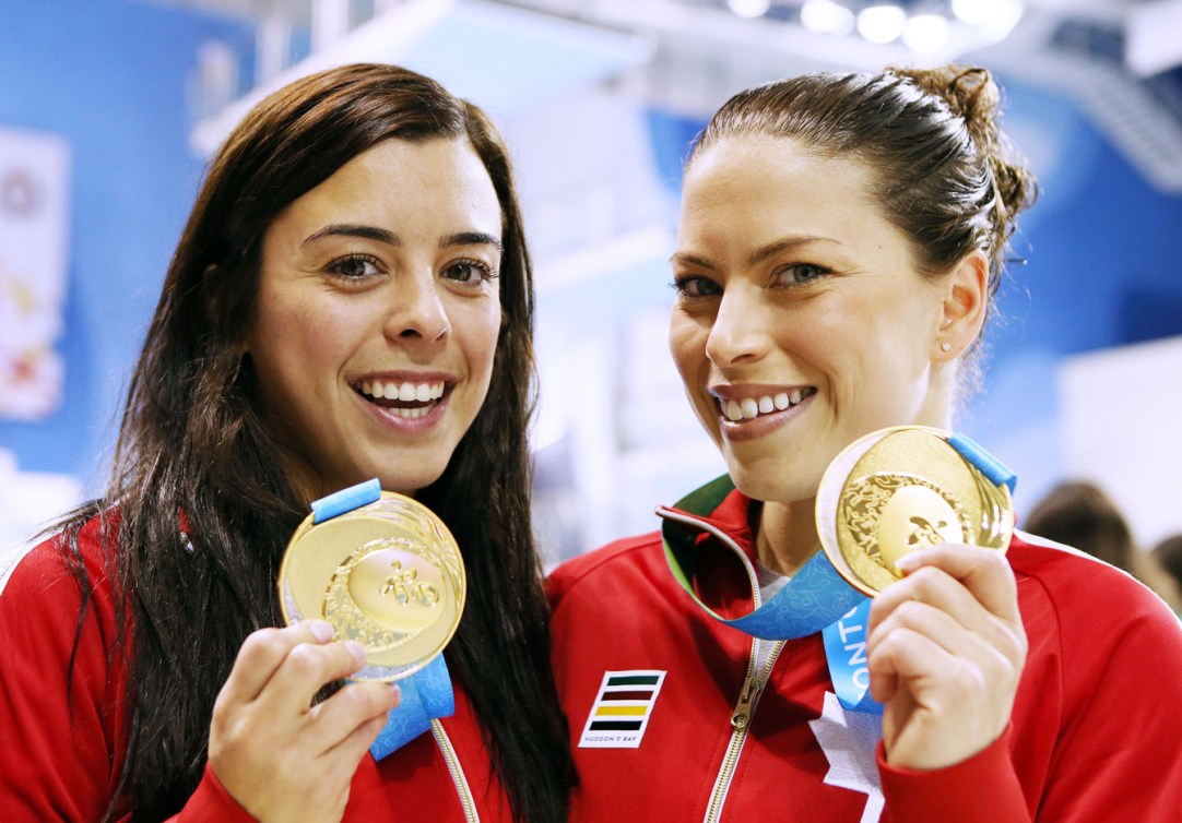 Meaghan Benfeito and Roseline Filion show off their synchronized 10m platform gold. (Photo: Vaughn Ridley)