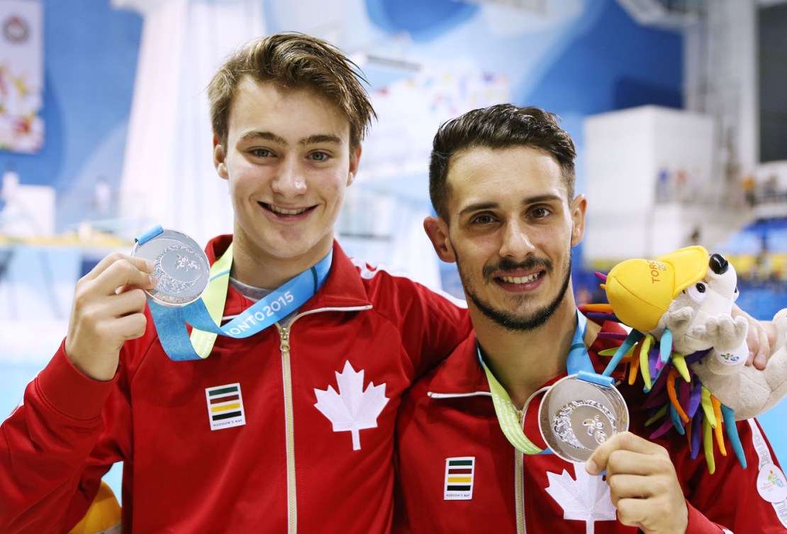 Philippe Gagné (left) and partner François Imbeau-Dulac are all smiles after winning silver in synchronized 3m springboard. (Phot: Vaughn Ridley)