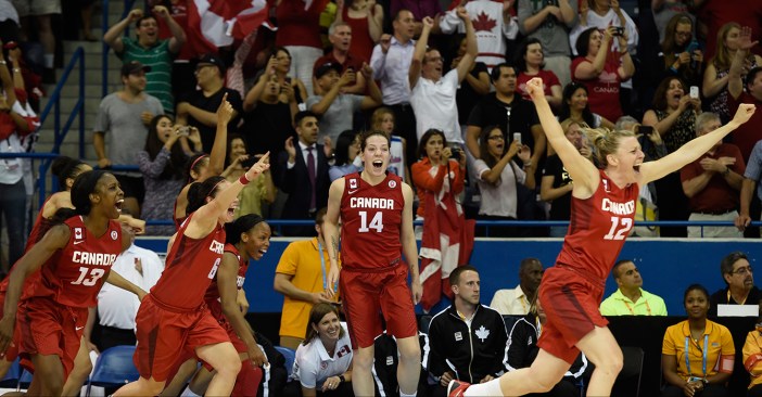 Canadian players run to the middle of the court at the buzzer after beating USA in Pan Am Games basketball for gold on July 20, 2015.