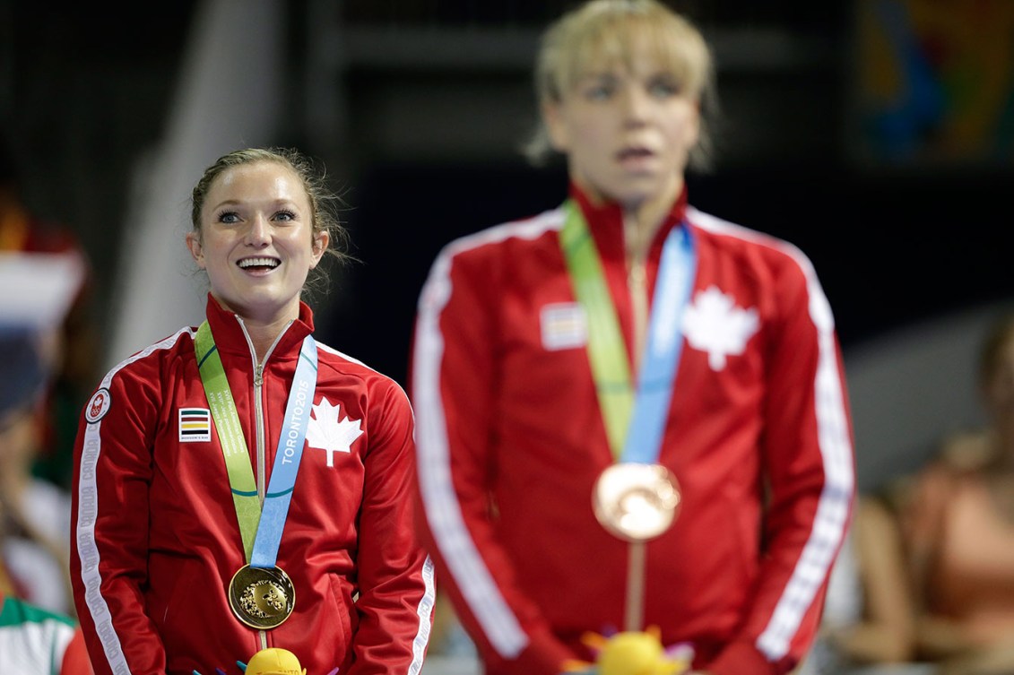 Canada's Rosie MacLennan listens to 'O Canada' after receiving her gold medal. Her teammate Karen Cockburn took the bronze.