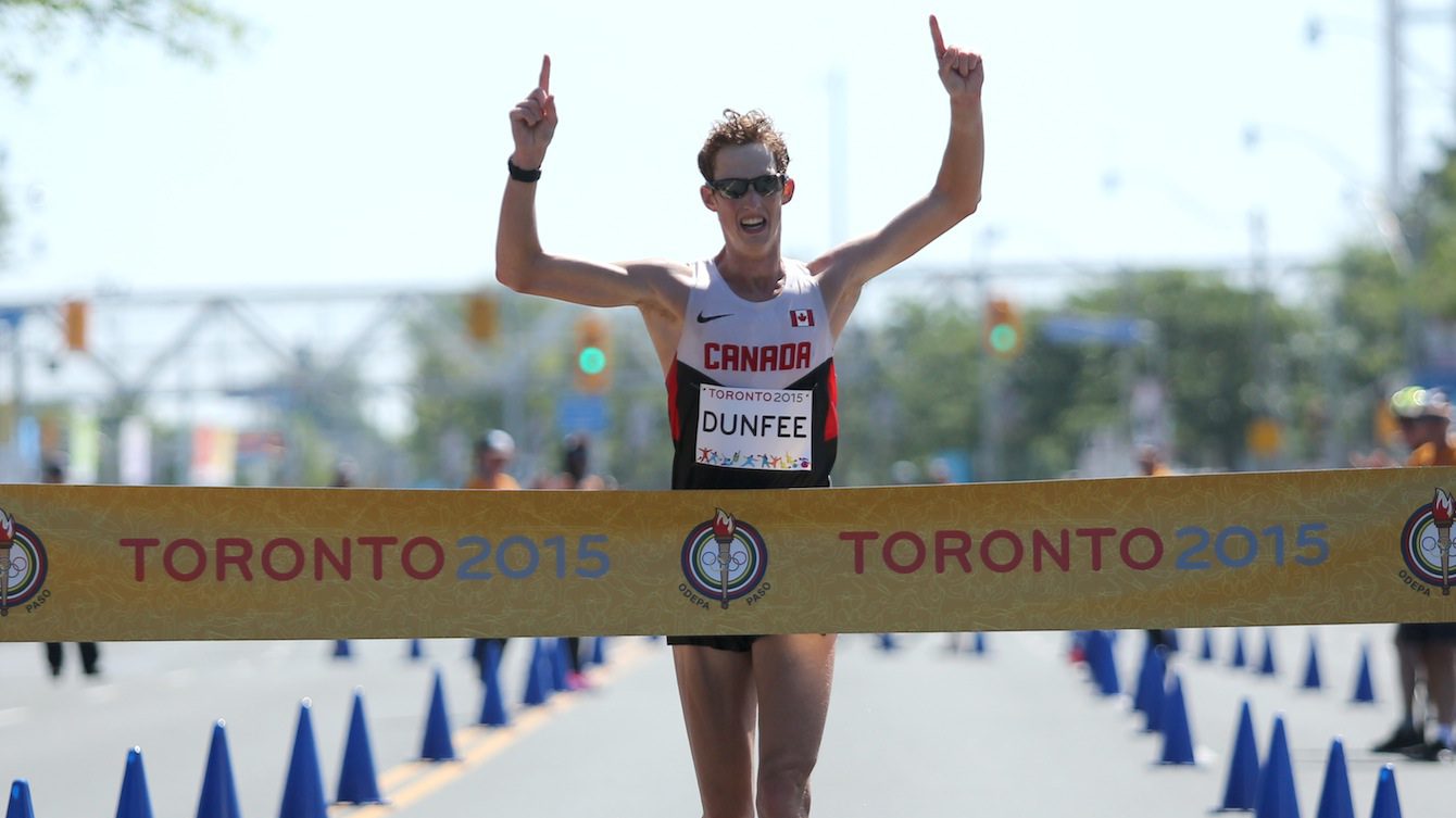 Evan dunfee crossing finish line