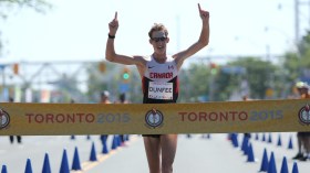 Evan dunfee crossing finish line