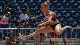 Sarah Wells competes in the women's 400m hurdles