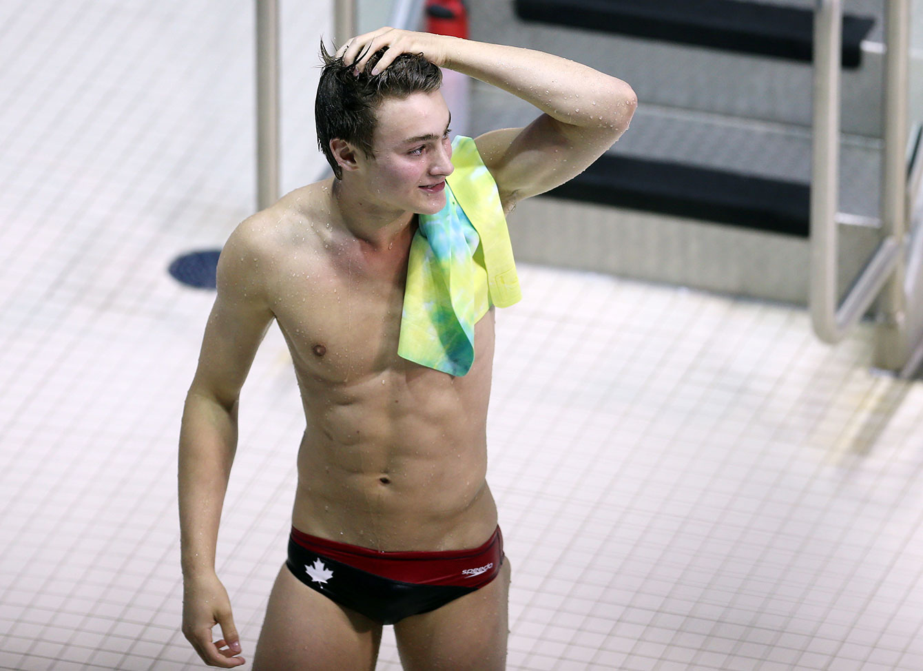 Philippe Gagné reacts to winning the bronze medal in the men's 3m springboard at TO2015.