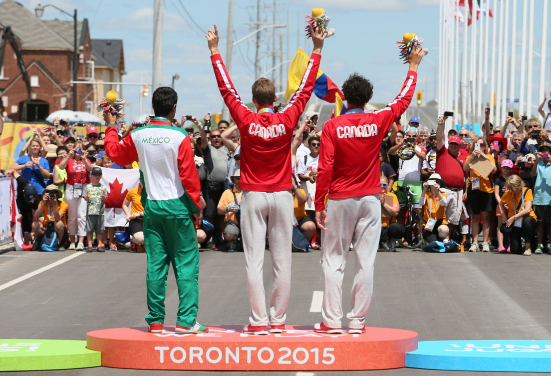 Hugo Houle won gold and teammate Sean MacKinnon took bronze in the men's road race at Toronto 2015 on July 22nd.