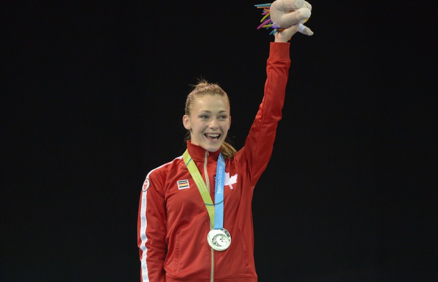 Kate Campbell smiling with her medal