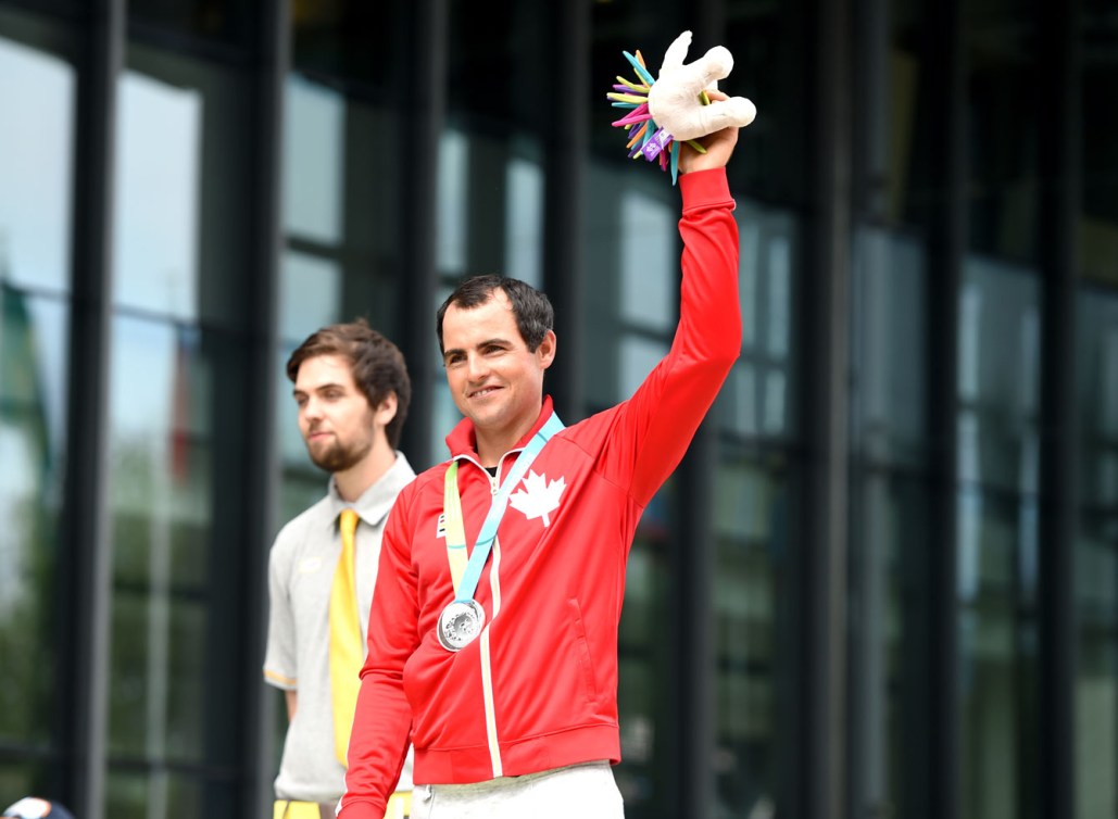 Luke Ramsay celebrates his silver medal from the sunfish division. (Photo: Jay Tse)