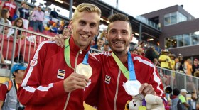 Matt Hughes and Alex Genest pose with their medals
