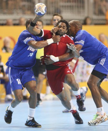 Tyrell Johnston of Edmonton tries to split the defence in Canada's win over the Dominican Republic 28 - 25 in round robin handball action at the Pan American Games in Toronto, Sunday, July 19, 2015 (Photo by Mike Ridewood/COC)