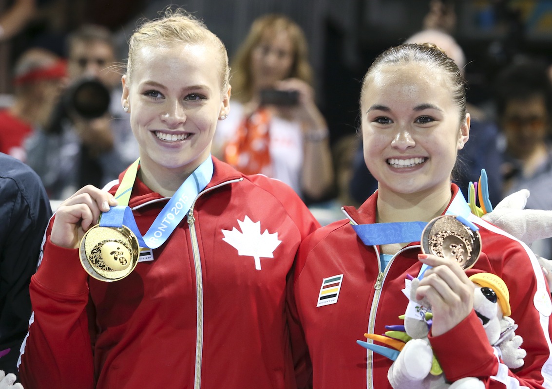 Ellie Black (left) of Halifax takes gold and Victoria Woo (right) of Brossard, Que. takes bronze in artistic gymnastics (beam) at the PanAmerican Games on July 15, 2015.